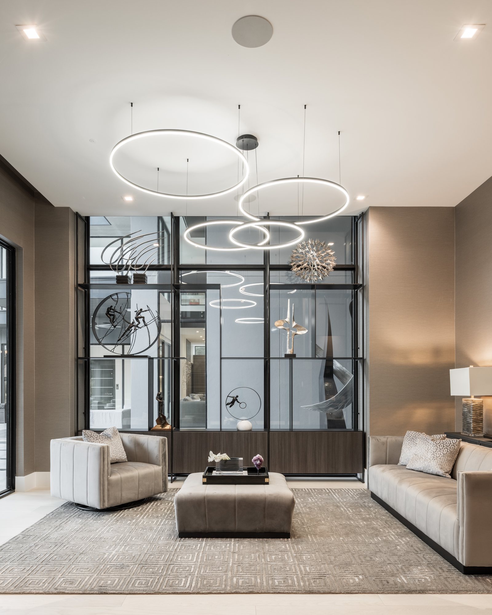 Designer living room with sculptural ring chandelier